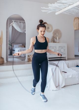 woman Skipping on a rope at home