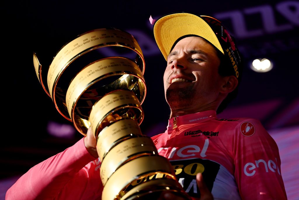 ROME ITALY MAY 28 Primo Rogli of Slovenia and Team JumboVisma Pink Leader Jersey celebrates at podium with the Trofeo Senza Fine as final overall race winner during the 106th Giro dItalia 2023 Stage 21 a 126km stage from Rome to Rome UCIWT on May 28 2023 in Rome Italy Photo by Tim de WaeleGetty Images