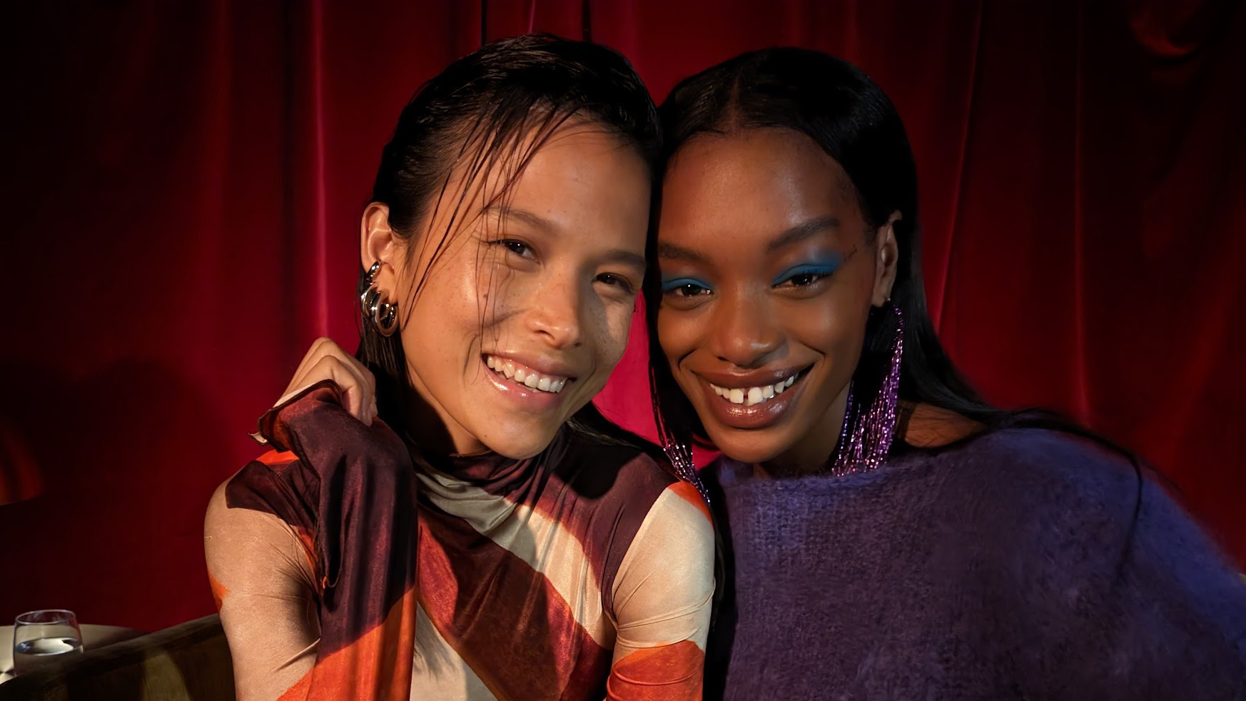 Two woman smiling in a bar