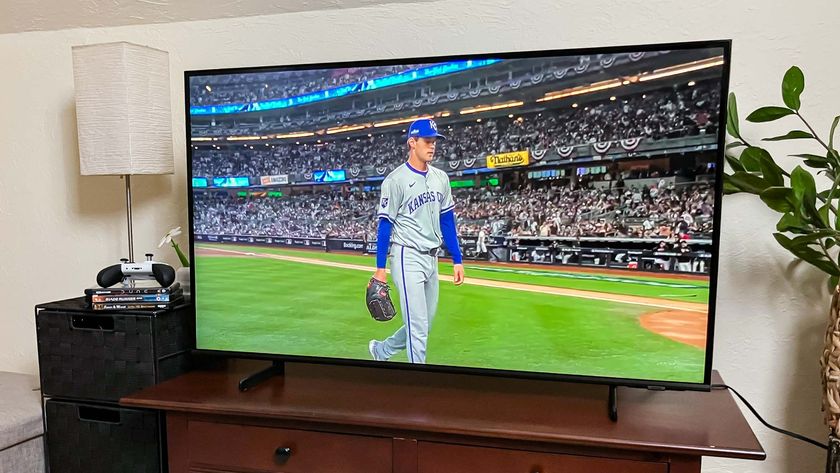 Samsung Q60D QLED TV on console in living room