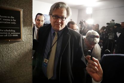 Stephen Bannon leaves the meeting of the House Republican caucus
