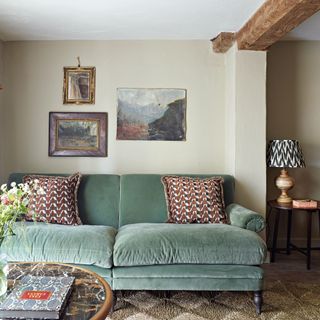 green velvet sofa in a cottage living room