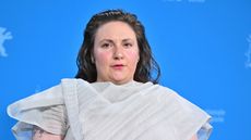 lena dunham on a blue background