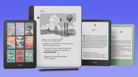 From left to right, the Amazon Kindle Colorsoft, Kindle Scribe with pen, Kindle Paperwhite, and green Kindle e-reader against a blue gradient background.