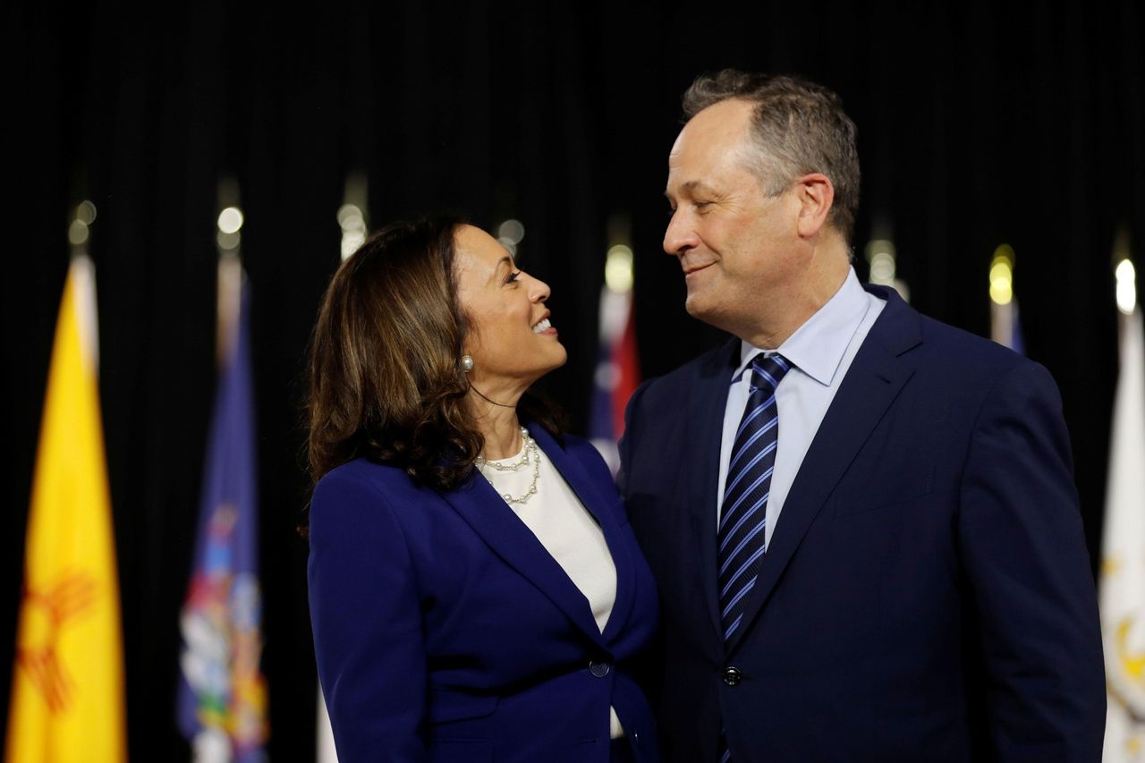 Democratic vice presidential candidate Senator Kamala Harris and her husband Douglas Emhoff are seen at the stage during a campaign event, first joint appearance since Biden named Harris as his running mate, at Alexis Dupont High School in Wilmington, Delaware, U.S