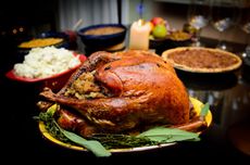 a traditional Thanksgiving meal including turkey, pumpkin pie and mashed potatoes