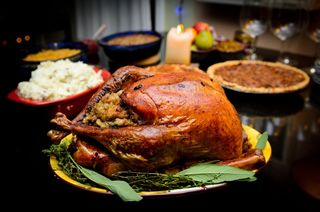 a traditional Thanksgiving meal including turkey, pumpkin pie and mashed potatoes