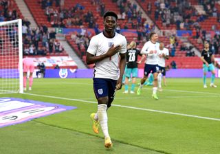 Bukayo Saka celebrating a goal for England