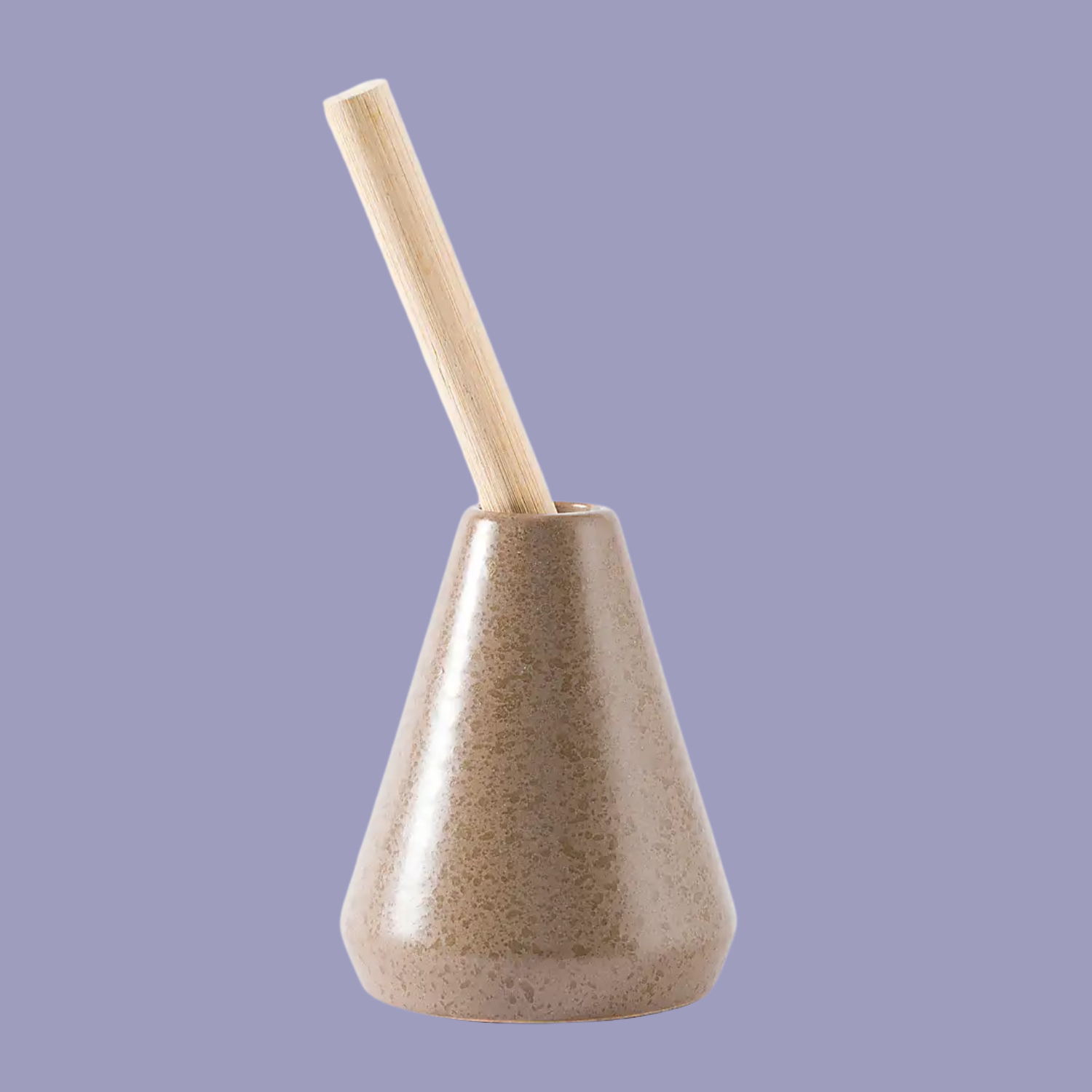 A ceramic diffuser bottle with a single solid reed against a purple background