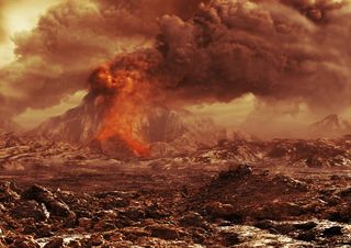 volcano spurting lava onto rocky brown/black surface