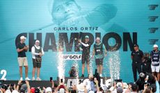 Carlos Ortiz celebrates on the podium at LIV Golf Houston