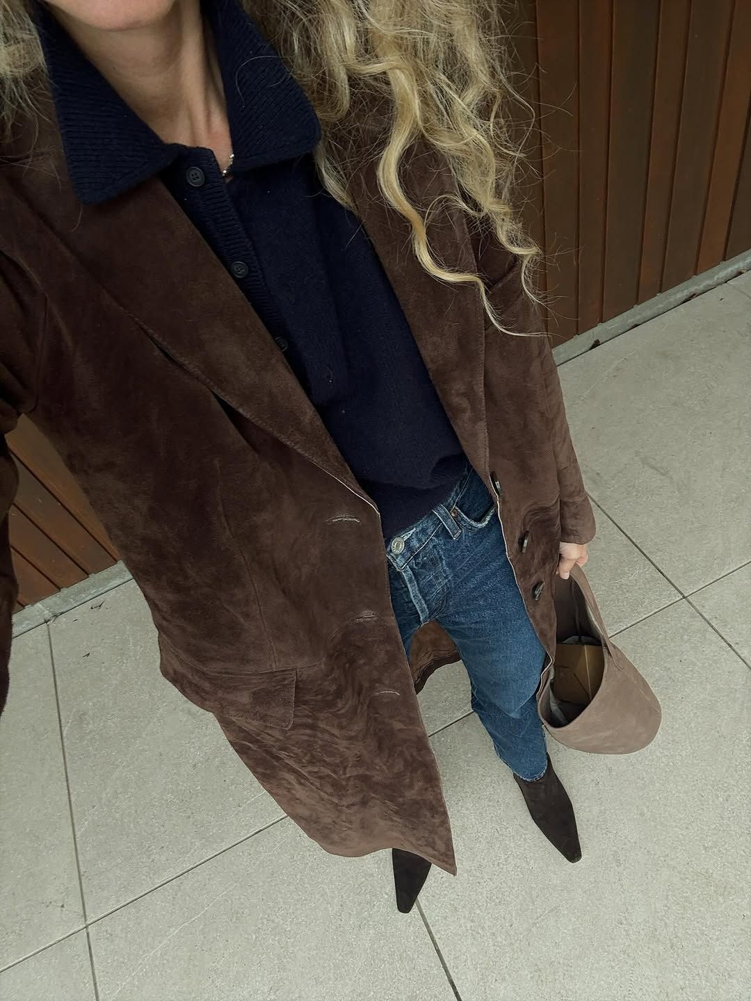 woman wearing suede pointed toe ankle boots trend 2025