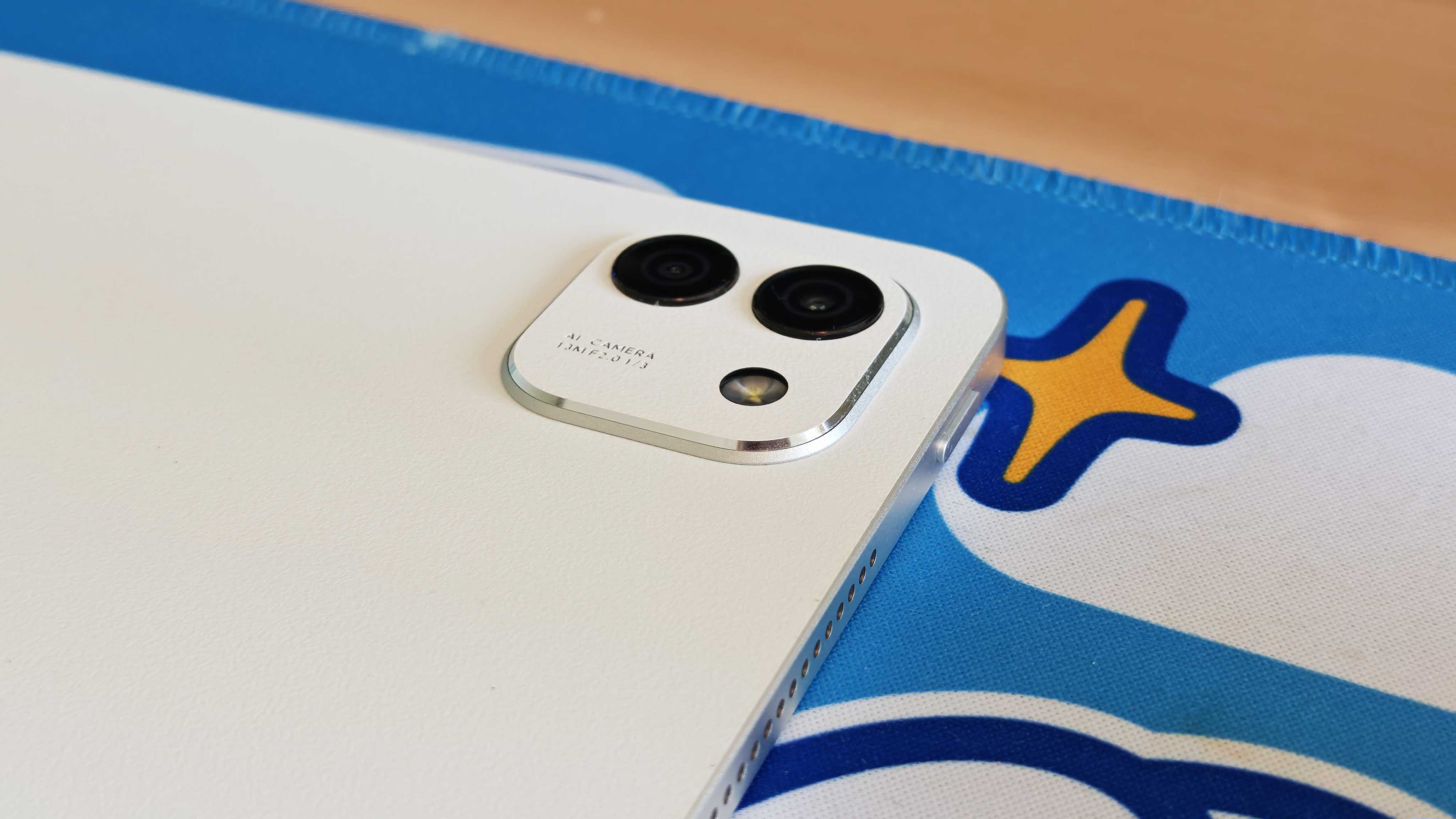 The Honor MagicPad 3 placed on a colorful desk mat.