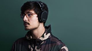 A man wearing a pair of gaming headphones