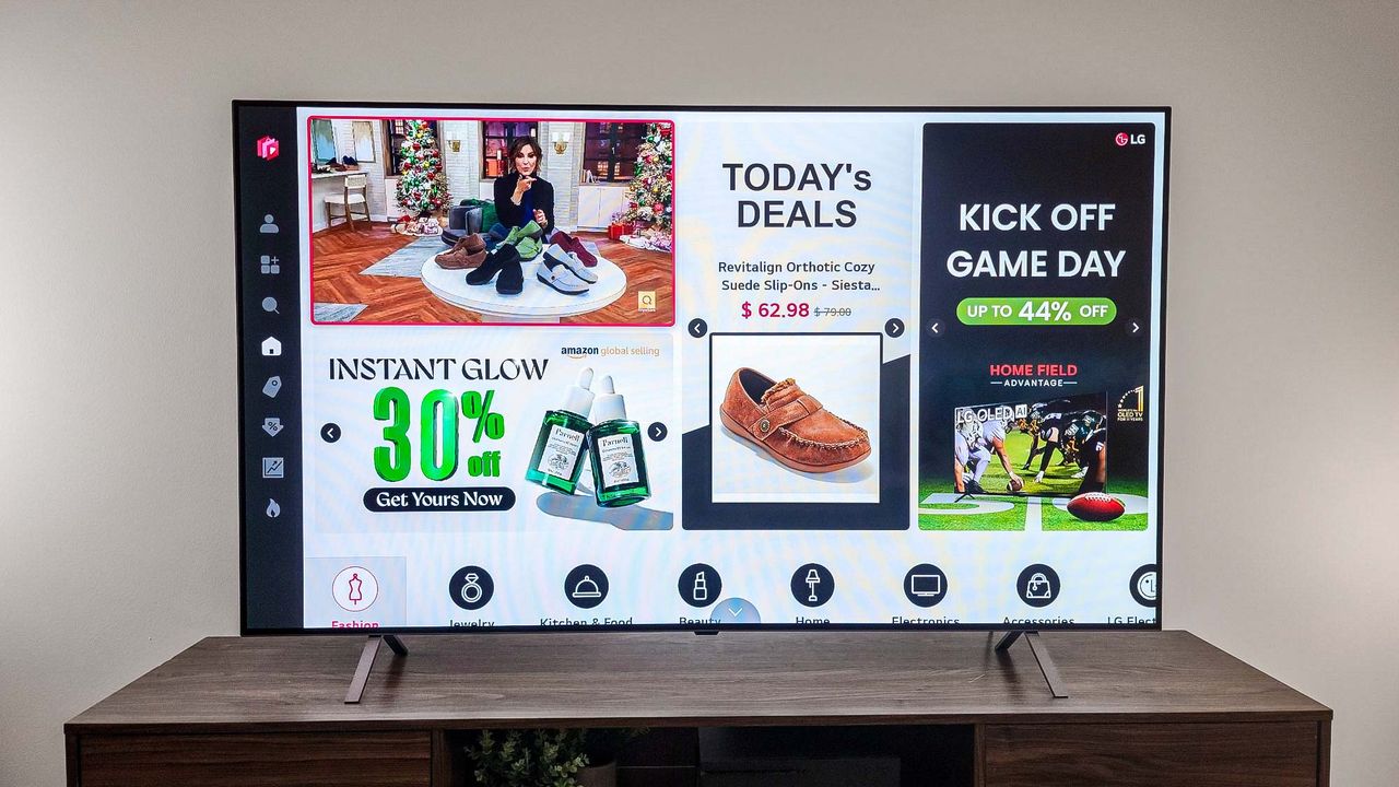 LG B4 OLED TV on table in living room