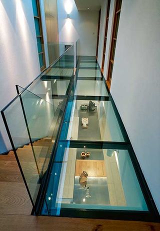 contemporary glazed walkway in coastal home