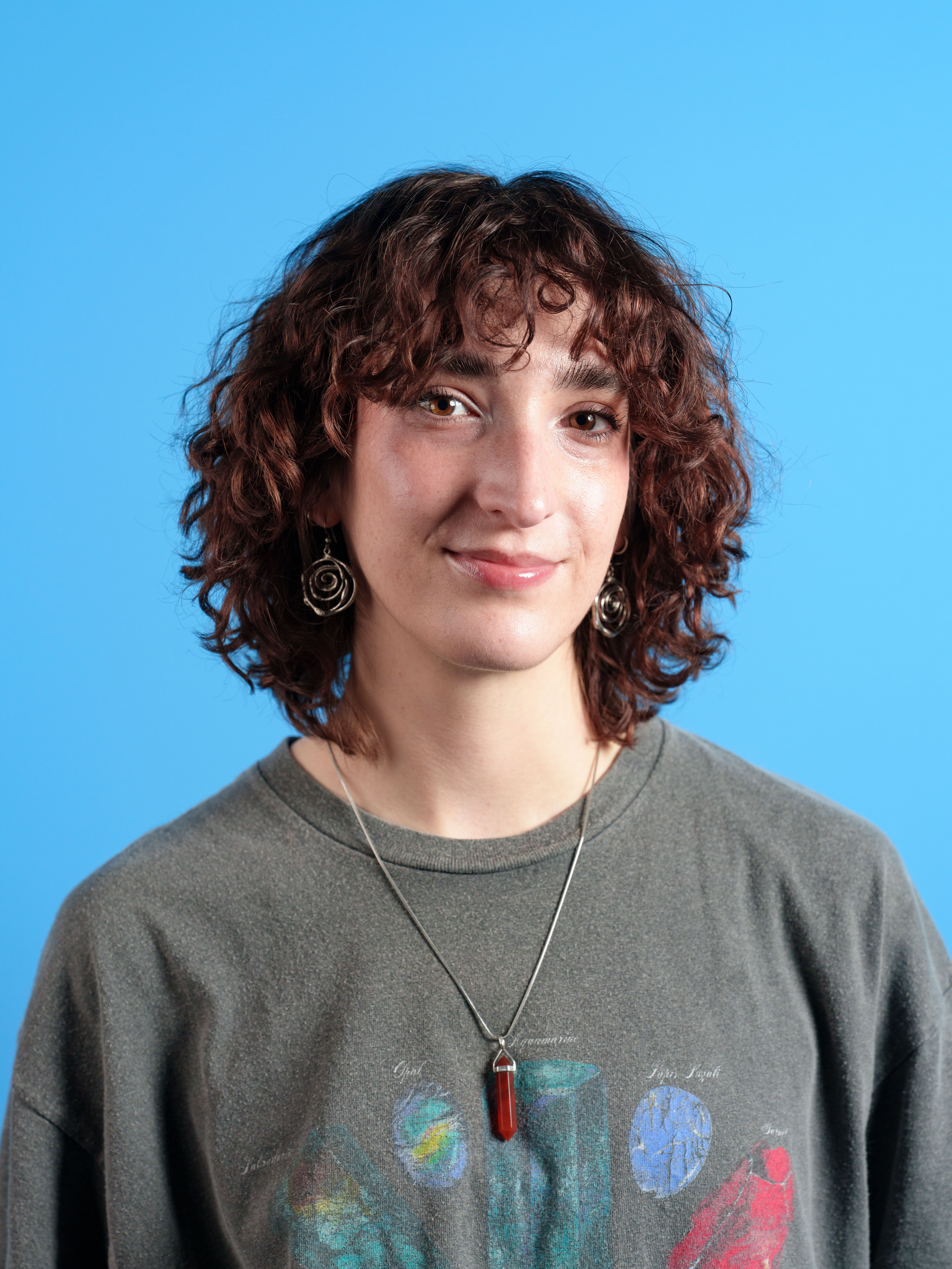 A portrait of a woman against a blue background