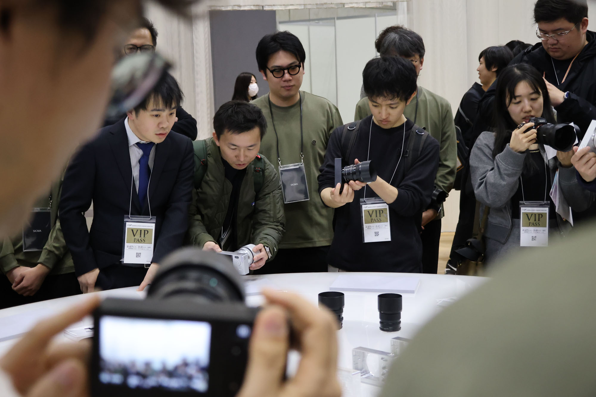 People surrounding the Sigma stand at the CP+ 2025 photography show, getting hands on the BF camera