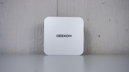 The Geekom A9 Max upright on a table