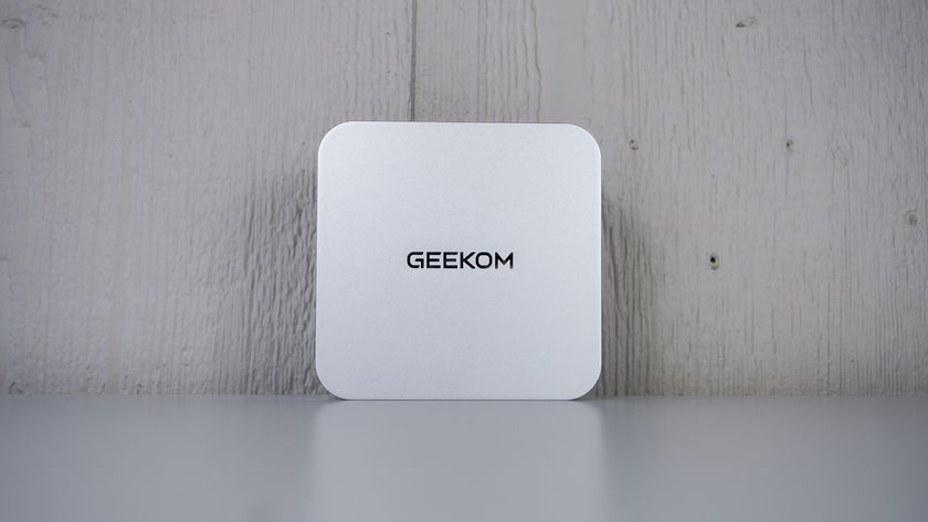 The Geekom A9 Max upright on a table