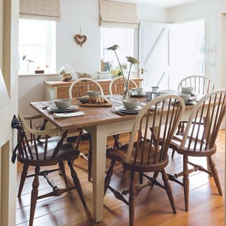 dining room with wooden flooring and wooden table and chair