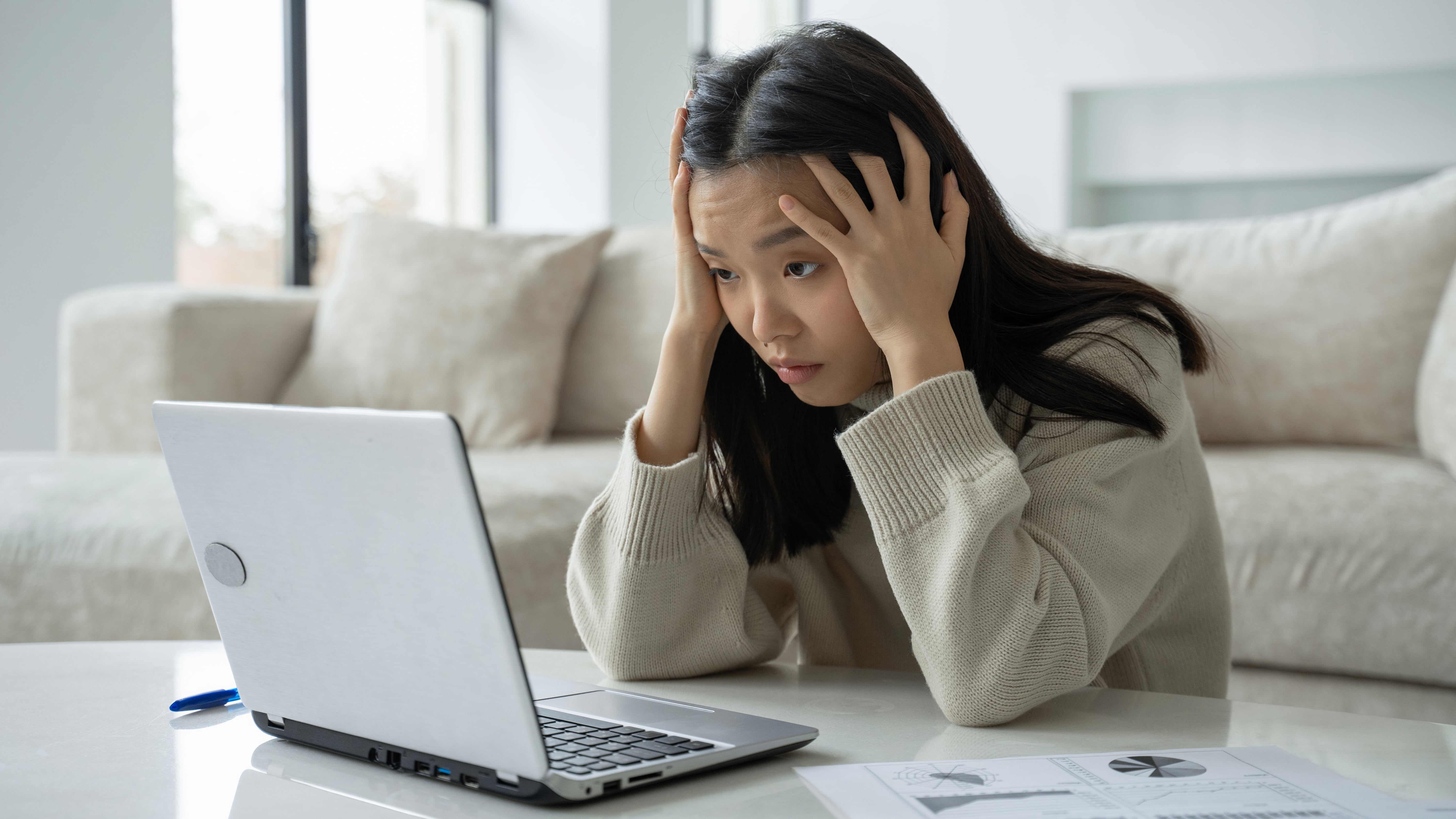 Woman stressing at laptop