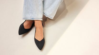 woman wearing Rothy's The Point II flats in black