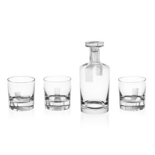 Three tumblers and one bottle in thick crystal glass with striped engraving