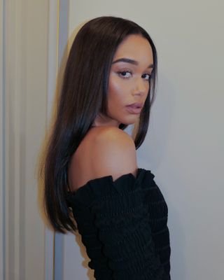 Laura Harrier with dark brunette hair colour