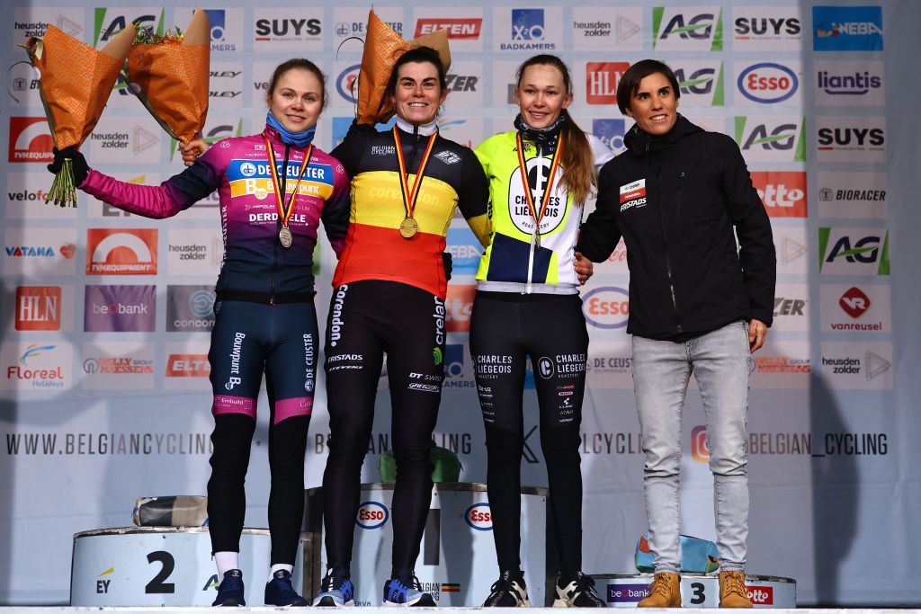 From left: Belgium's Laura Verdonschot, Belgium's Marion Norbert Riberolle and Belgium's Julie Brouwers celebrate on the podium after competing in the women's Elite race, the Belgian Championships cyclocross, in Heusden-Zolder on January 11, 2025. (Photo by DAVID PINTENS / Belga / AFP) / Belgium OUT