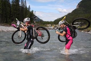 A rider negotiates a water passage in the TransRockies