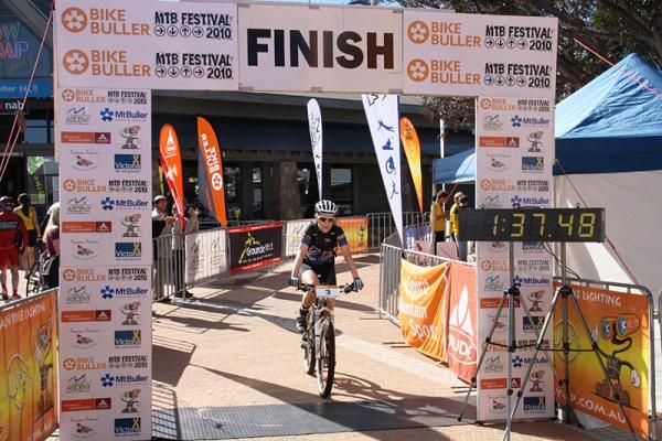 Women's winner Tory Thomas cross the finish line,
