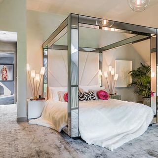 kate moss the lakes by yoo bedroom with mirrored four poster bed and cushions