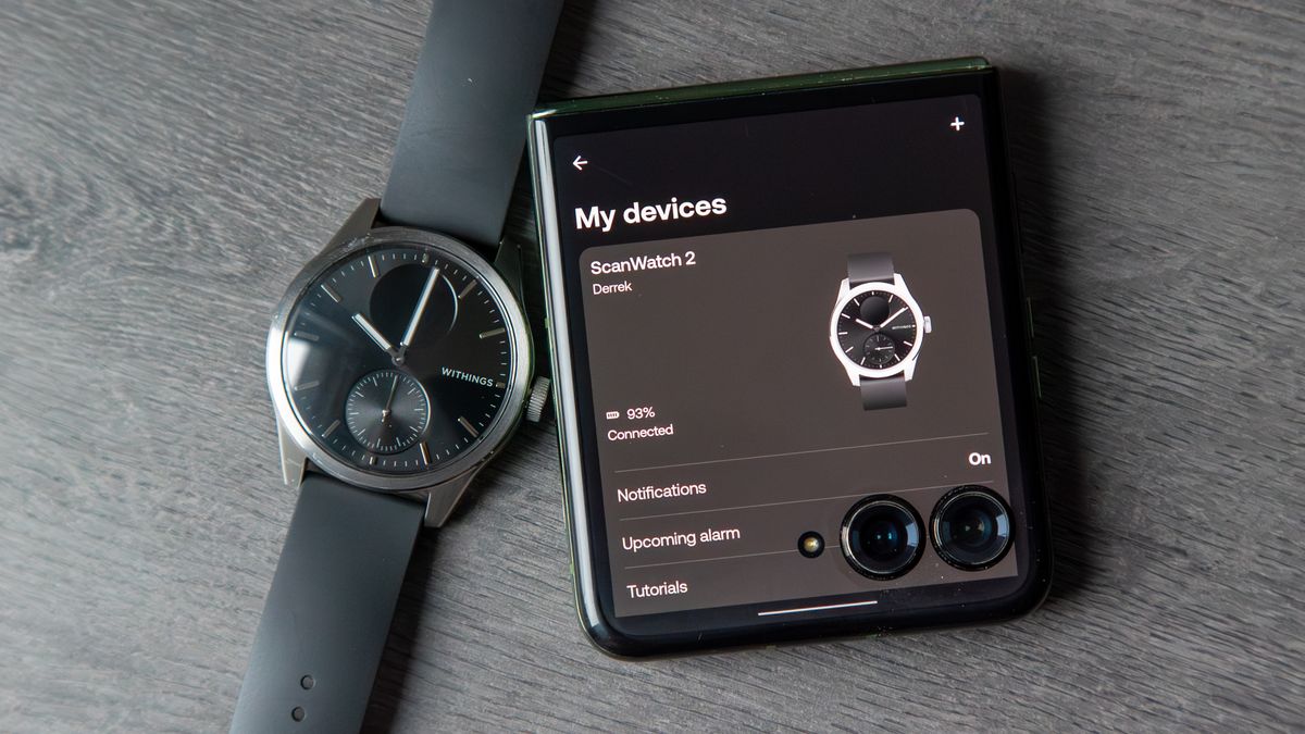 The Withings ScanWatch 2 next to a phone with the Withings app open