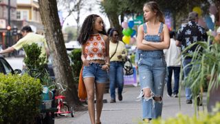 Lexi Underwood and Sadie Stanley as Isabella and Megan walking next to each other in Cruel Summer season 2