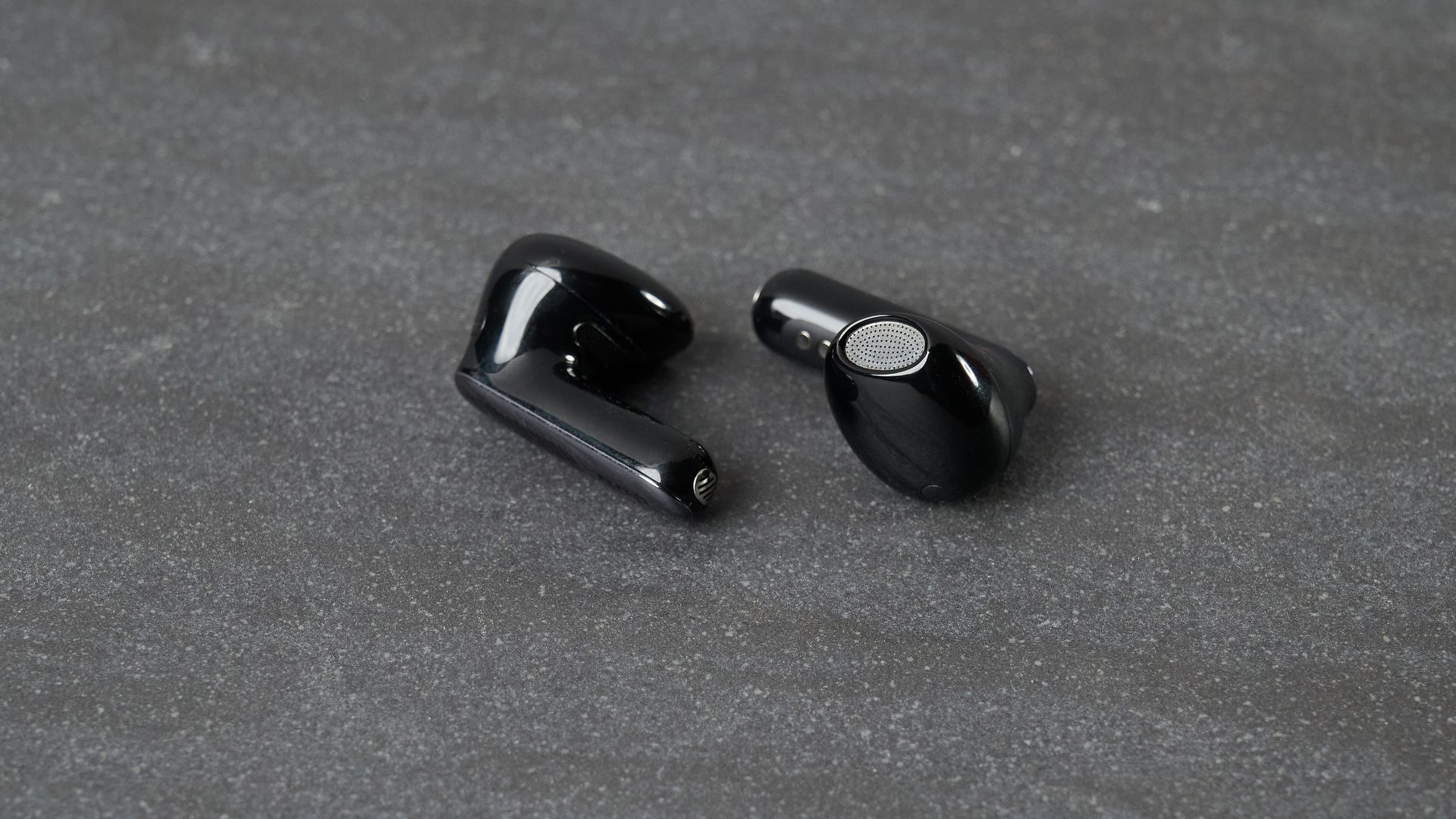 JBL Live Flex 4 earbuds on table