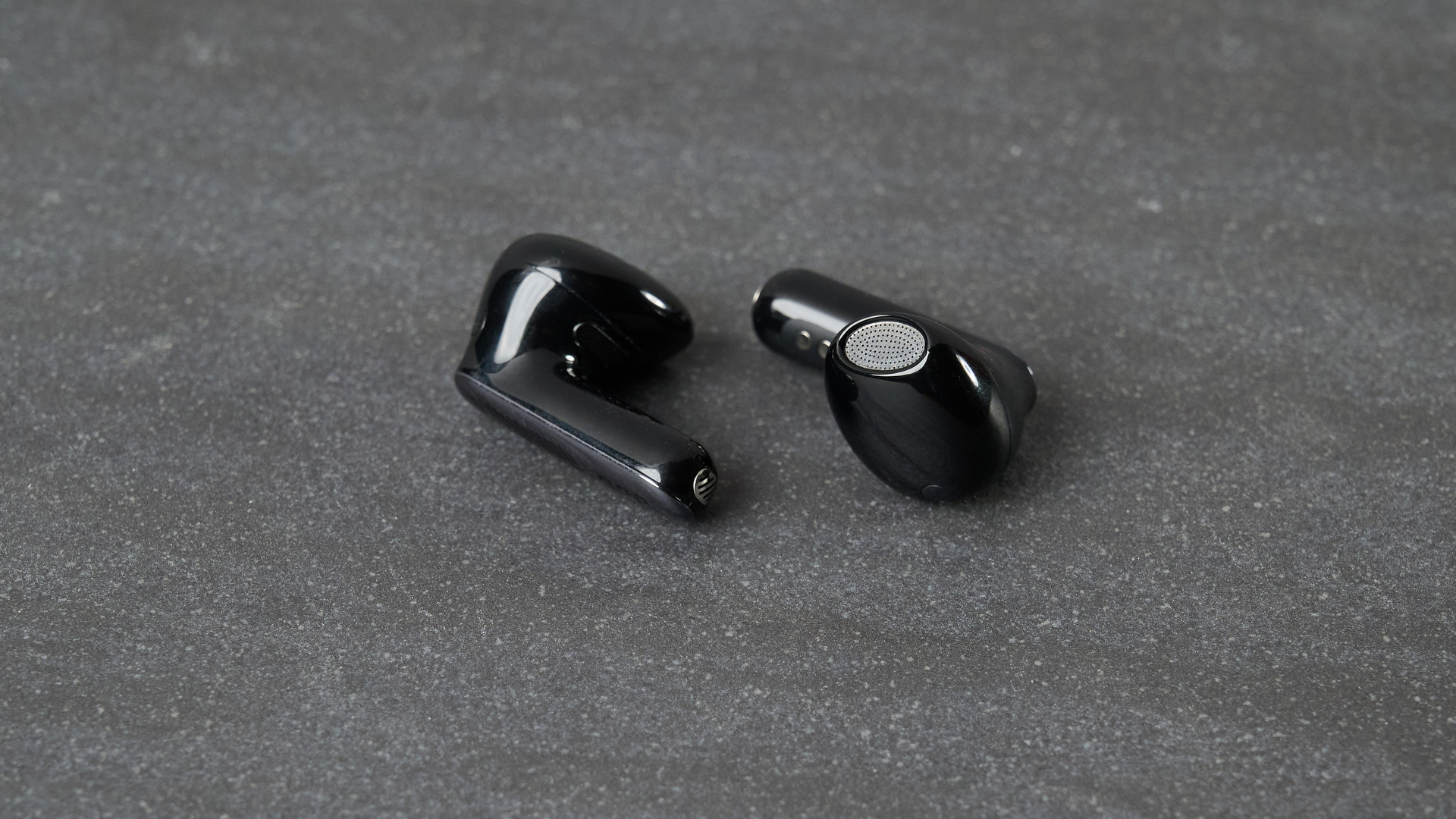 JBL Live Flex 4 earbuds on table
