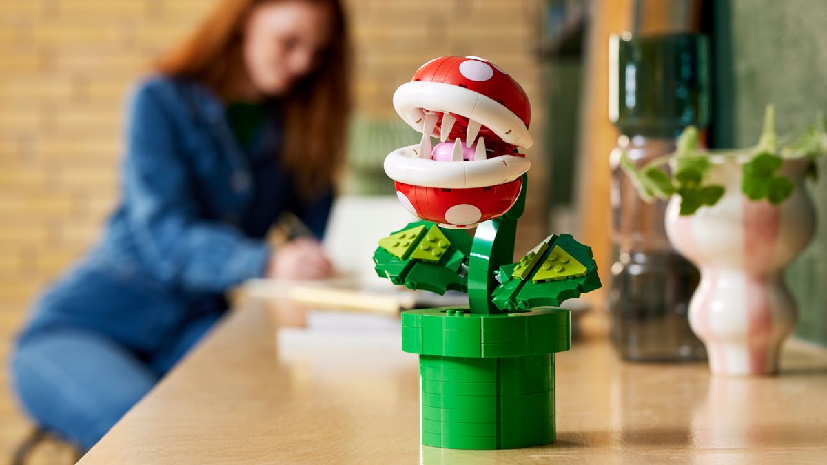Lego Piranha Plant sat on a wooden table