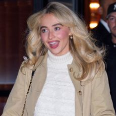 Sabrina Carpenter wears a white turtleneck sweater