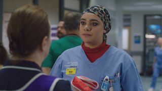 Rida is moved when Siobhan hands her the red emergency nurse bib and puts her in charge of resus.