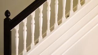 picture of white and black wooden bannisters