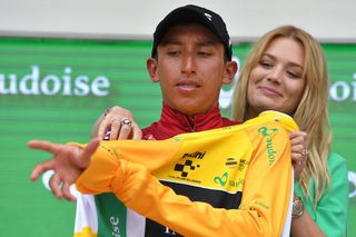 Egan Bernal puts on the yellow jersey after stage 7 at Tour de Suisse