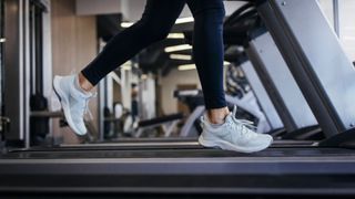 Women's feet running on a treadmill