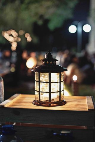 patio lighting ideas: lantern with fairy lights