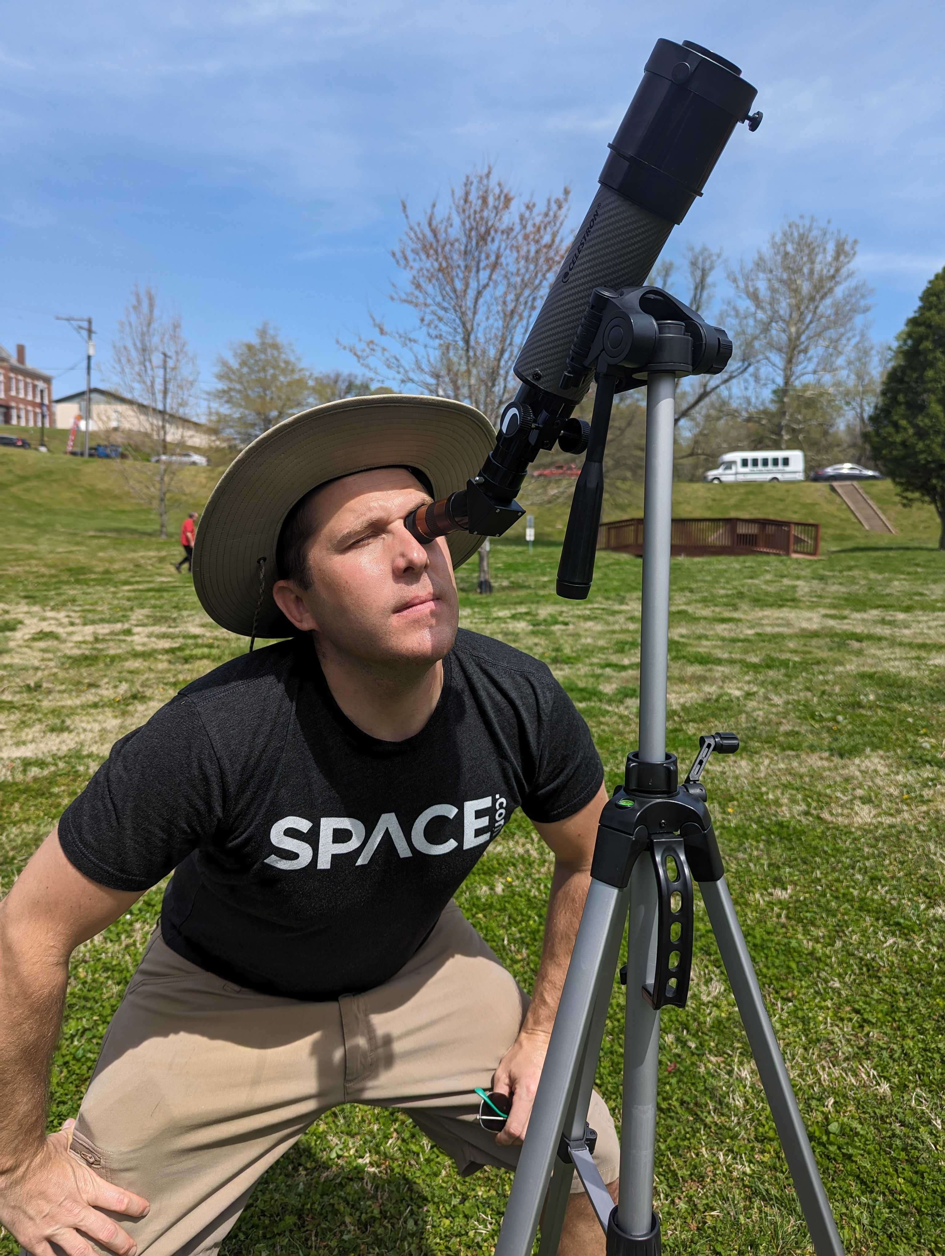 Man Looking Through Telescope Ahead Of Total Solar Eclipse
