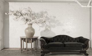 Flower vase and black sofa