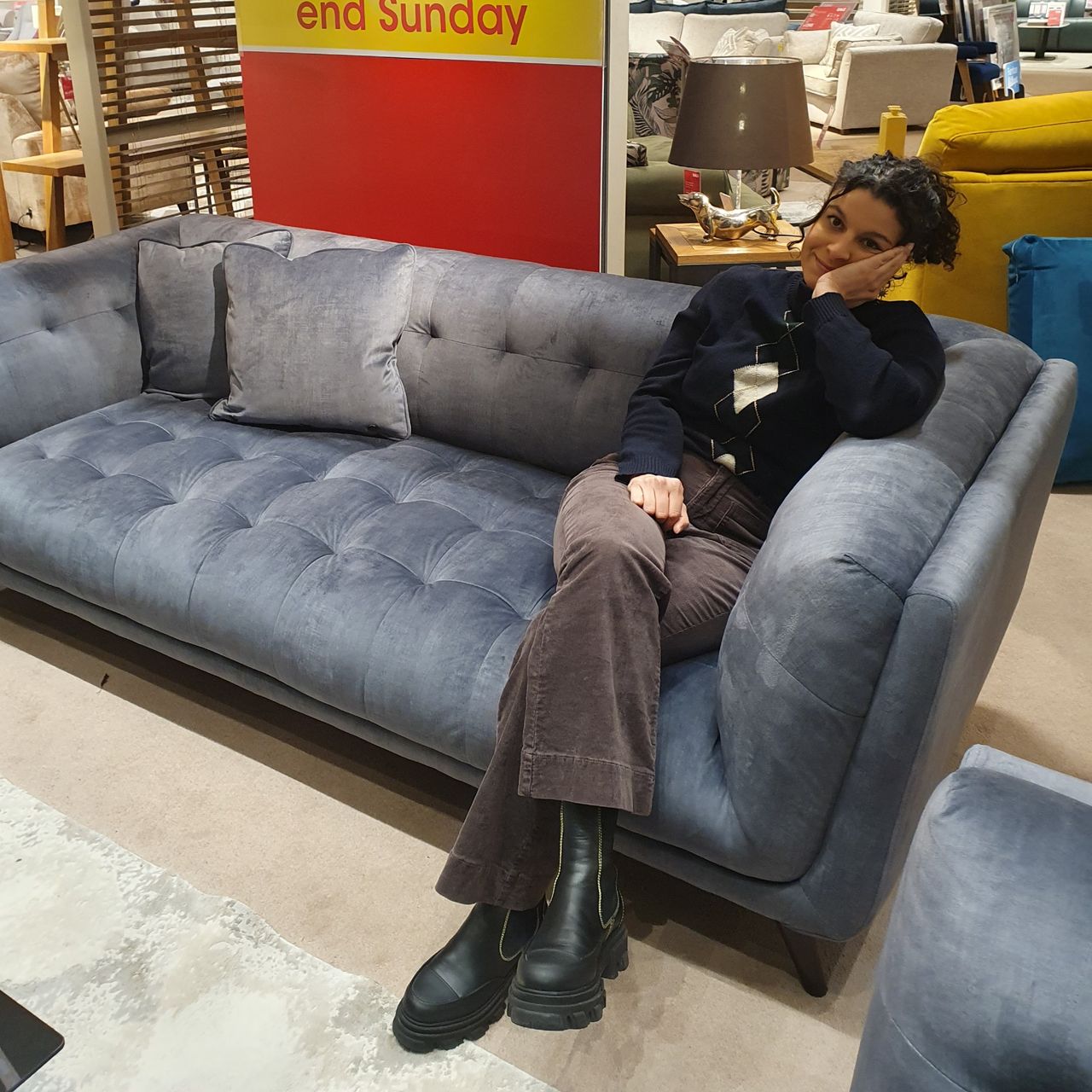 Sara sitting on the Furniture Village Rene sofa