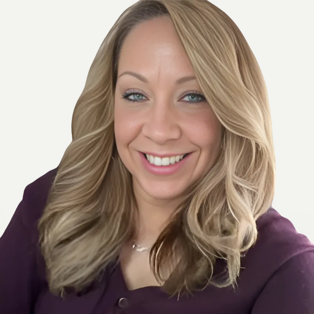 a headshot photo of professional organizer, Tina Priestly: a woman in a dark purple button up long sleeve with medium blonde hair smiling at the camera