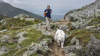 Man hiking with dog on Appalachian Trail