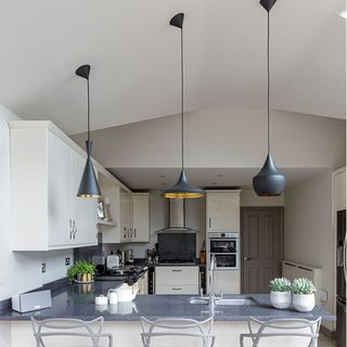 kitchen island lighting ideas with three black pendant lights